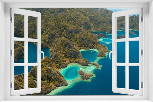 Fototapeta Naklejka Na Ścianę Okno 3D - Aerial view: Mountain Barracuda lake, on tropical island, Lagoon with blue, azure water. Lake in the mountains covered with tropical forest on the island Coron, Palawan, Philippines.