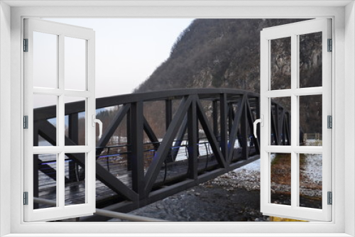 Fototapeta Naklejka Na Ścianę Okno 3D - Metal bridge is located in the IDRO commune in the province of Brescia, a metal bridge with a gentle multi-colored light.