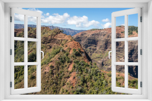 Aerial view of Waimea Canyon and landscape of hawaiian island of Kauai from helicopter flight