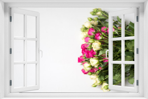 Fototapeta Naklejka Na Ścianę Okno 3D - Pink and white rose bush collected in a bouquet. Beautiful floristry for weddings, holidays. Floral decoration of flowers. Copy space and top view. Panorama light background.