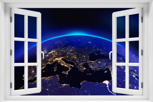 Fototapeta Naklejka Na Ścianę Okno 3D - Europe at night from space with glowing city lights - Elements of this image furnished by NASA