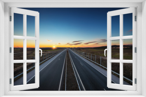 Fototapeta Naklejka Na Ścianę Okno 3D - Aerial view of highway and beautiful sunset, travel around the world