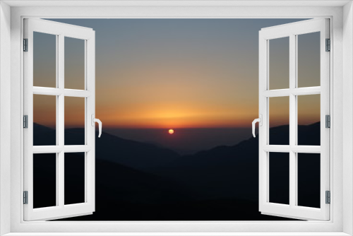 Fototapeta Naklejka Na Ścianę Okno 3D - Sunset in the mountains. View from the height.