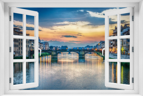 Fototapeta Naklejka Na Ścianę Okno 3D - View of the Arno river, evening Florence and the St Trinity Bridge. Florence, Italy.