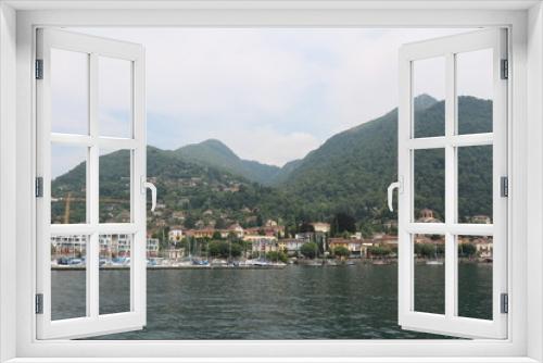 Fototapeta Naklejka Na Ścianę Okno 3D - View tLaveno Mombello at the Lago Maggiore from a car ferry, Italy