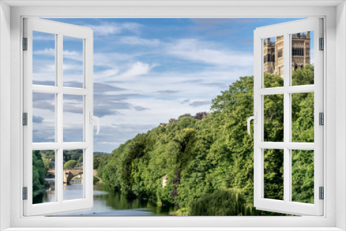 Fototapeta Naklejka Na Ścianę Okno 3D - cathedral towers protruding above the forest next to the river Wear near Durham. 