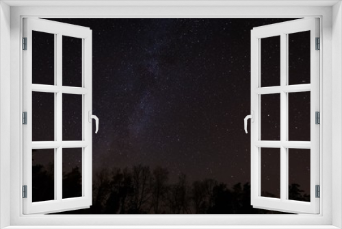Fototapeta Naklejka Na Ścianę Okno 3D - Beautiful night sky with Milky Way over forest.