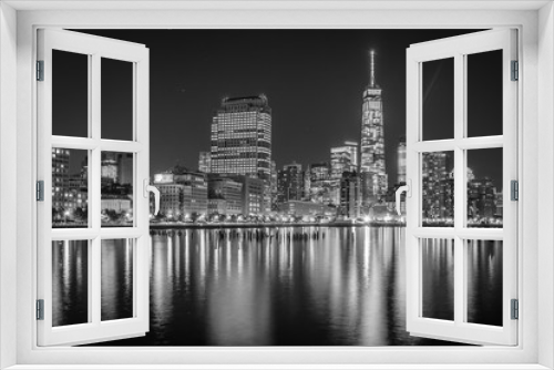 Fototapeta Naklejka Na Ścianę Okno 3D - One World Trade Center and Battery Park City at night, seen from Pier 34, Manhattan, New York.