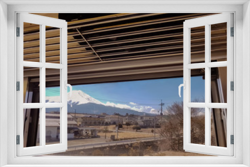 Fototapeta Naklejka Na Ścianę Okno 3D - The beautiful scenery of Fujisan and the community Looking through the running train window