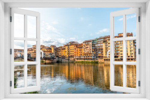 Fototapeta Naklejka Na Ścianę Okno 3D - Florence, Italy Firenze orange yellow colorful buildings and Arno river during summer morning sunrise in Tuscany