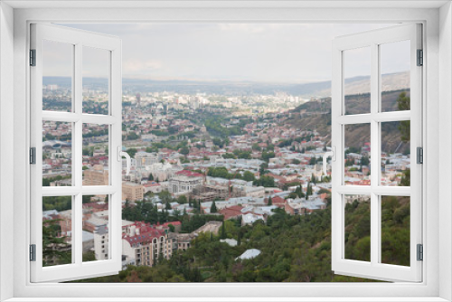 Fototapeta Naklejka Na Ścianę Okno 3D - Overlooking the center of Tbilisi from the Mtatsminda mountain. Tbilisi is the capital of Georgia