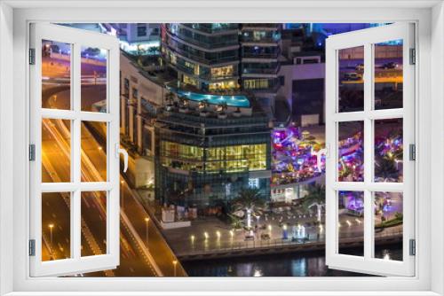 Fototapeta Naklejka Na Ścianę Okno 3D - Luxury Dubai Marina canal and promenade night timelapse, Dubai, United Arab Emirates