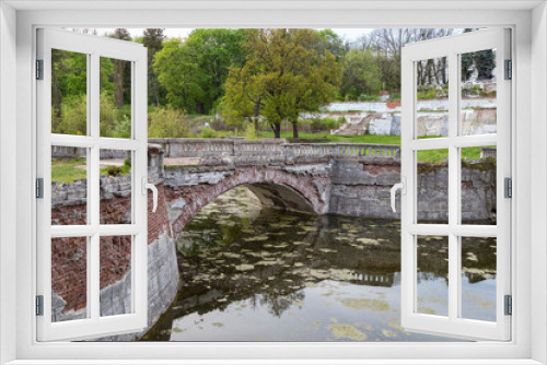 Fototapeta Naklejka Na Ścianę Okno 3D - Old park with pond and bridge .Sharovka Castle . Ukraine.
