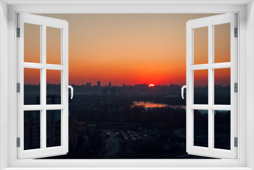Fototapeta Naklejka Na Ścianę Okno 3D - Sunset over the city