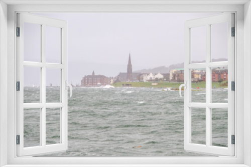 Fototapeta Naklejka Na Ścianę Okno 3D - Storm Eric Hits the Seafront of Largs in the West Coast of Scotland High Winds and Waves break onto the Foreshore. Image was taken through heavy Rain.