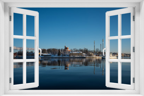 Fototapeta Naklejka Na Ścianę Okno 3D - A cold winter  day in Stockholm with snow and ice on islands and boats
