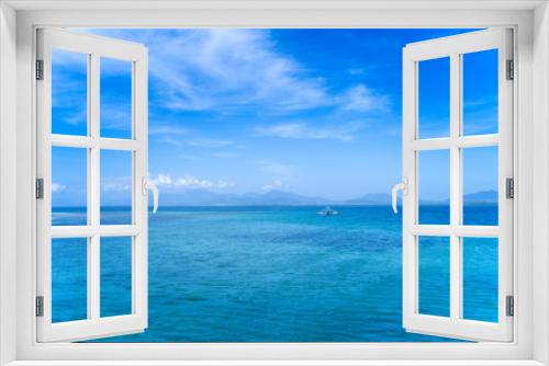 Fototapeta Naklejka Na Ścianę Okno 3D - Beautiful ocean scene view isolated with light blue sky background, concept of vacation and sea travel, copy space