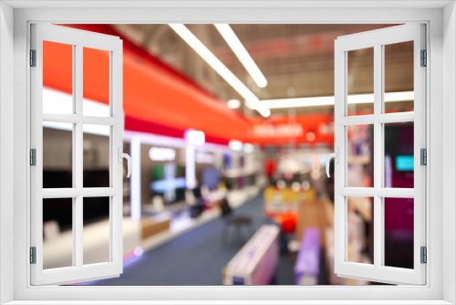 Blurred view of modern shopping mall interior