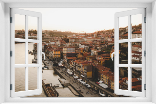 Fototapeta Naklejka Na Ścianę Okno 3D - Porto cityscape with red roofs and river while sunset