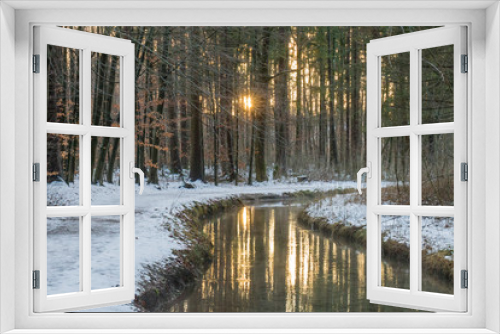 Fototapeta Naklejka Na Ścianę Okno 3D - Deep snowy forest road at a stream in winter