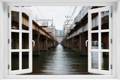 Fototapeta Naklejka Na Ścianę Okno 3D - Beautiful bridge at Umeda from across the Yodogawa River.