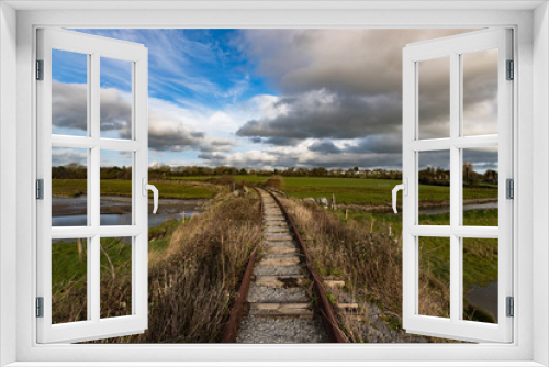 Fototapeta Naklejka Na Ścianę Okno 3D - landscape of old unused and abandonned rusty train tracks in rural Ireland
