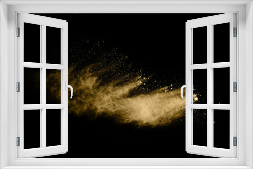 Fototapeta Naklejka Na Ścianę Okno 3D - Golden powder explosion on black background. Freeze motion.