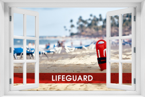 Fototapeta Naklejka Na Ścianę Okno 3D - Lifeguard standing in the sand. lifeguard float. Rescue on water