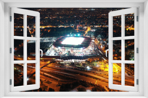 Fototapeta Naklejka Na Ścianę Okno 3D - Aerial drone photo of famous illuminated football stadium of Karaiskaki in the heart of Piraeus, Attica, Greece