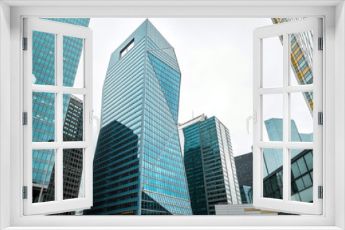 Fototapeta Naklejka Na Ścianę Okno 3D - Modern skyscrapers view in business downtown distric under sky i