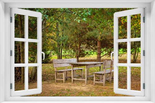 Fototapeta Naklejka Na Ścianę Okno 3D - Table in the garden in autumn