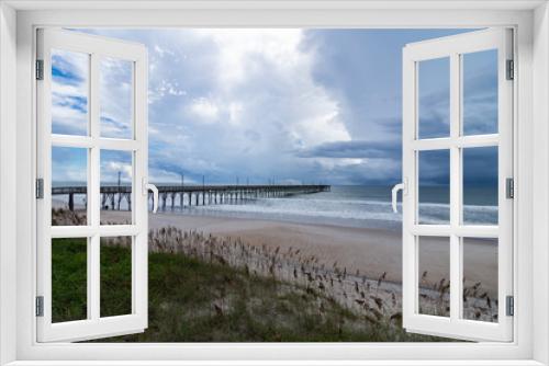 Fototapeta Naklejka Na Ścianę Okno 3D - Ocean pier in stormy skies