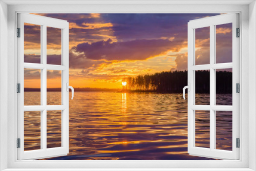 Fototapeta Naklejka Na Ścianę Okno 3D - Panoramic sunset, sunrise over the river with the island, the sun shines through the tree branches of the sky in the clouds.