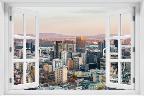 Fototapeta Naklejka Na Ścianę Okno 3D - Montreal skyline, with the iconic buildings of the Downtown and the CBD business skyscrapers taken from the Mont Royal Hill. Montreal is the main city of Quebec, and the second city in Canada