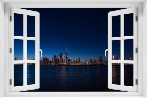 Fototapeta Naklejka Na Ścianę Okno 3D - Panoramic view of Dubai cityscape at night