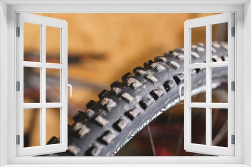 Fototapeta Naklejka Na Ścianę Okno 3D - Mountain bike tire tread closeup at home workshop