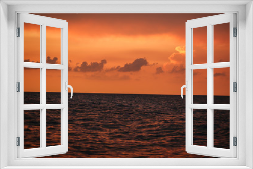Fototapeta Naklejka Na Ścianę Okno 3D - Fiery orange sunset over the sea