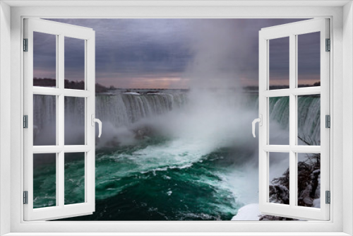 Fototapeta Naklejka Na Ścianę Okno 3D - Niagara Falls CANADA - February 23, 2019: Winter frozen idyll at Horseshoe Falls, the Canadian side of Niagara Falls, view showing as well as the upper Niagara River