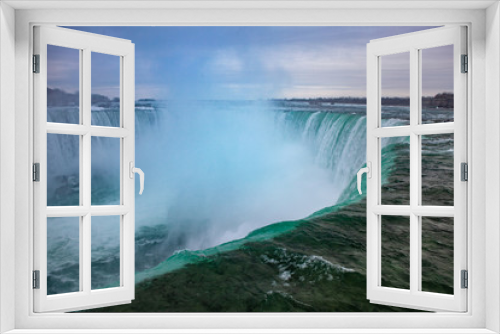 Fototapeta Naklejka Na Ścianę Okno 3D - Niagara Falls CANADA - February 23, 2019: Winter frozen idyll at Horseshoe Falls, the Canadian side of Niagara Falls, view showing as well as the upper Niagara River