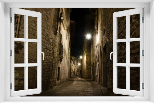 Fototapeta Naklejka Na Ścianę Okno 3D - Medieval old street in Assisi by night, Umbria, central Italy