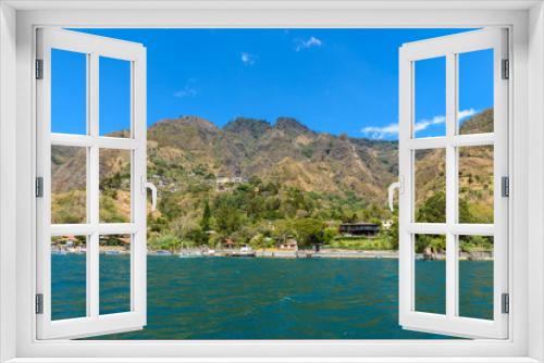 Fototapeta Naklejka Na Ścianę Okno 3D - Shore of Santa Cruz la Laguna at Lake Atitlan in vulcano landscape of Guatemala