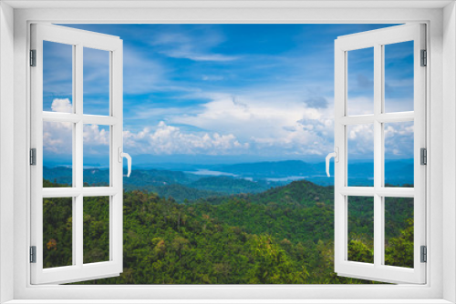 Blue sky high peak mountains fog hills mist scenery river lake dam bay gulf wildlife  National park views Kanchanaburi, Thailand.