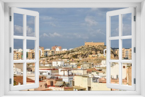 Fototapeta Naklejka Na Ścianę Okno 3D - The rooftops of Cartagena leading towards a distant fort on a lonely hill in the middle of the city