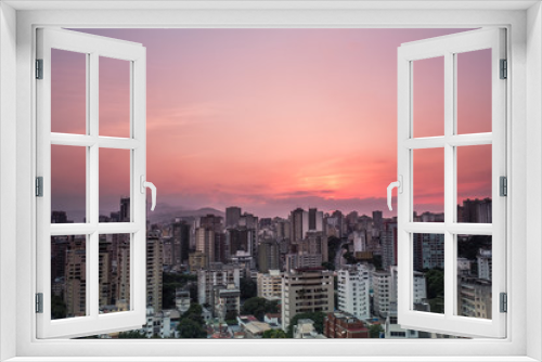 Fototapeta Naklejka Na Ścianę Okno 3D - View of Caracas city from west side during a sunset. Venezuela