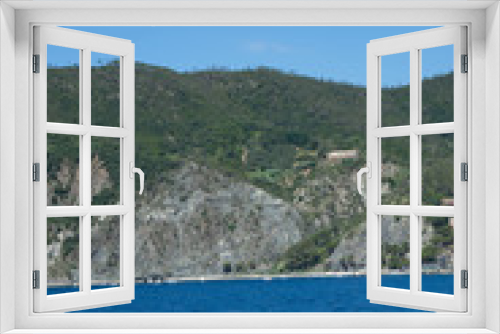 Fototapeta Naklejka Na Ścianę Okno 3D - Italy, Cinque Terre, Monterosso, a large body of water with a mountain in the background