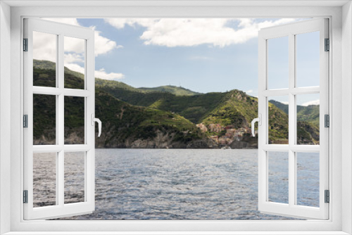 Fototapeta Naklejka Na Ścianę Okno 3D - Italy, Cinque Terre, Monterosso, a body of water with a mountain in the background