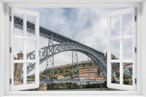 Fototapeta Naklejka Na Ścianę Okno 3D - The Dom Luis I Bridge is a metal arch bridge that spans the Douro River between the cities of Porto and Vila Nova de Gaia