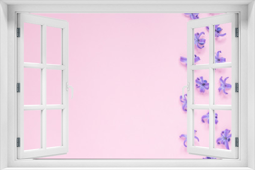 Fototapeta Naklejka Na Ścianę Okno 3D - Floral beautiful pastel pink background. Purple small flowers of Hyacinth. Flat lay, top view, copy space