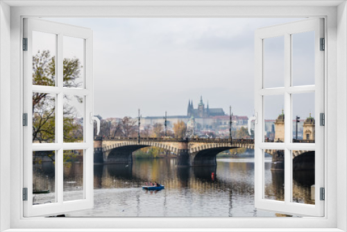 The Vltava river, The Vltava river, Charles bridge and white swans in Prague, Czech Republic in Prague, Czech Republic