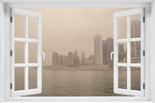 Fototapeta Naklejka Na Ścianę Okno 3D - USA. New York City. Manhattan early in the morning. Thick fog. Embankment and skyscrapers.